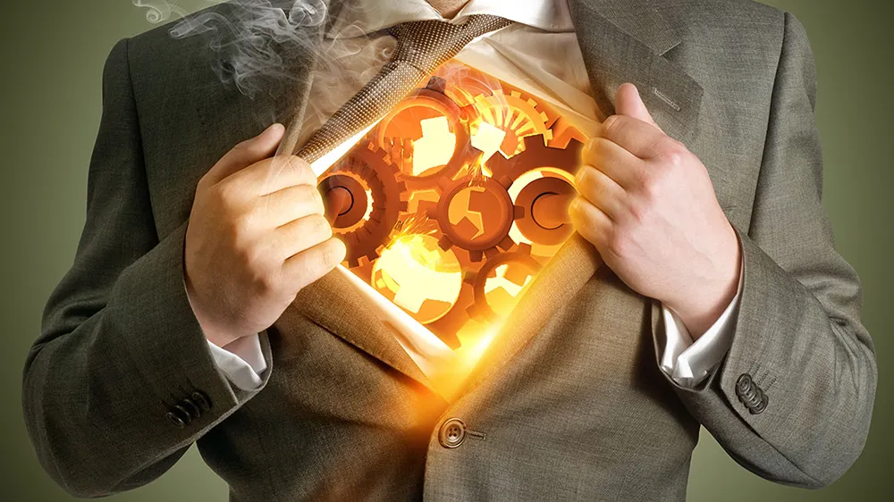 A man wearing a suit opening the shirt and blazer to expose a fantastical clockwork interior that glows bright yellow.