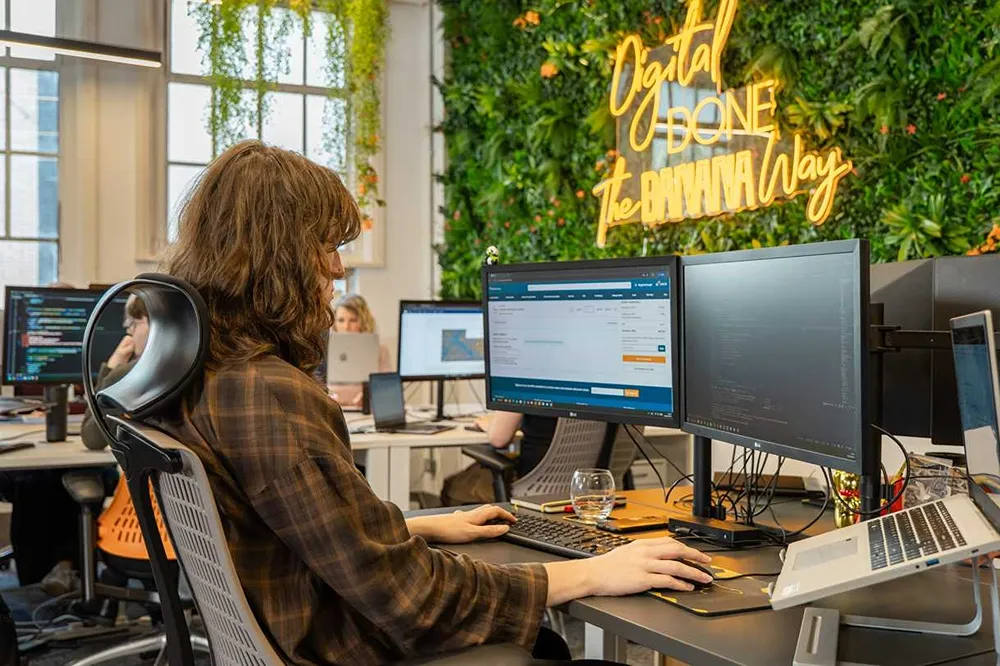 Cold Banana employee working at their desk on a client site.