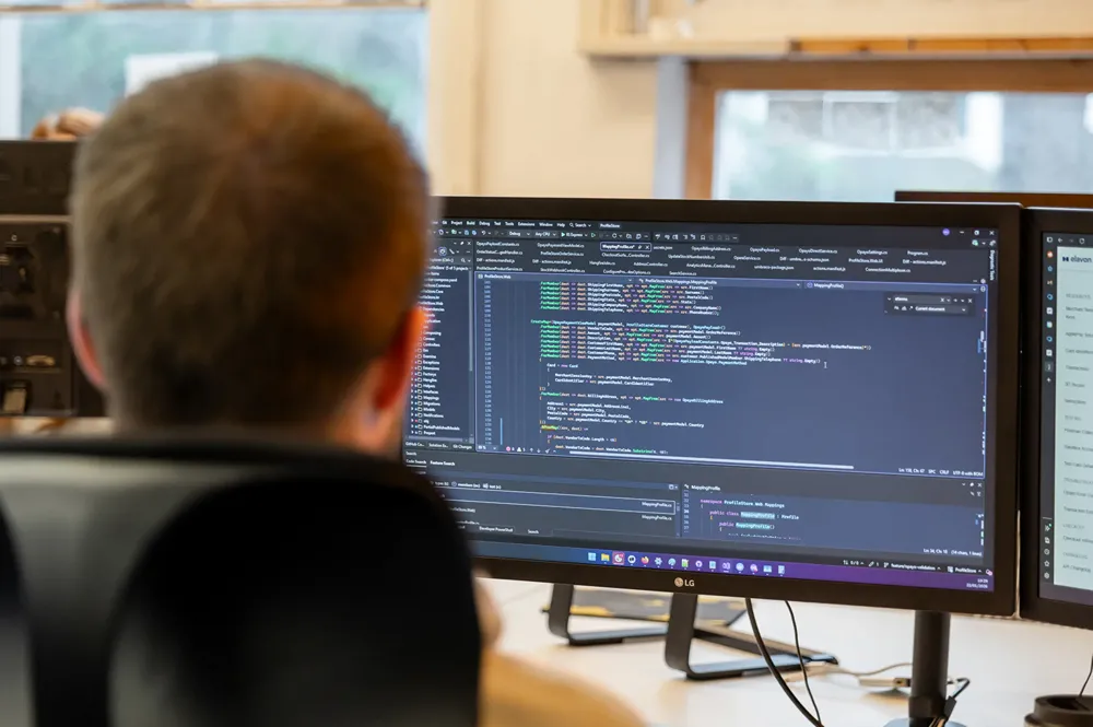 Cold Banana developer working at his desk on code.