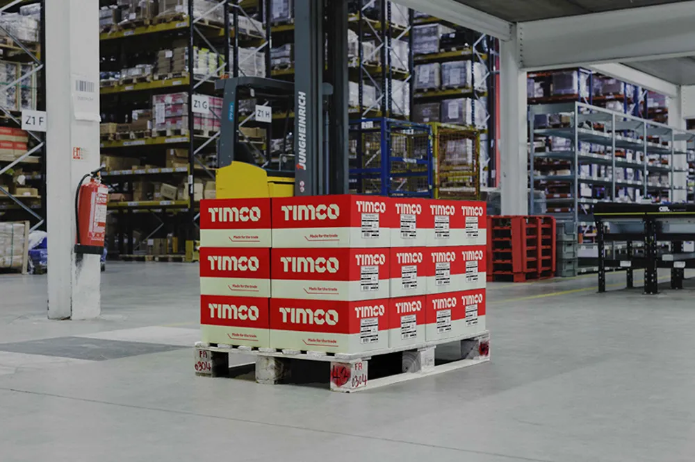 A pallet of TIMCO branded boxes in a warehouse