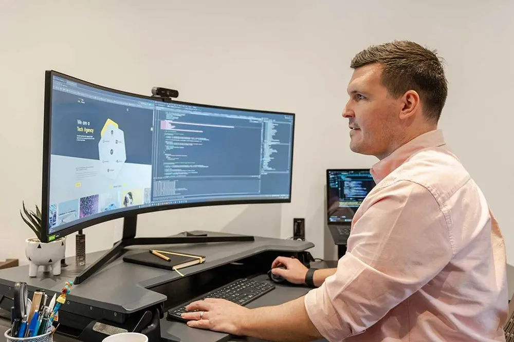 Luke Fribbens, Founder and CEO of Cold Banana working at this desk.