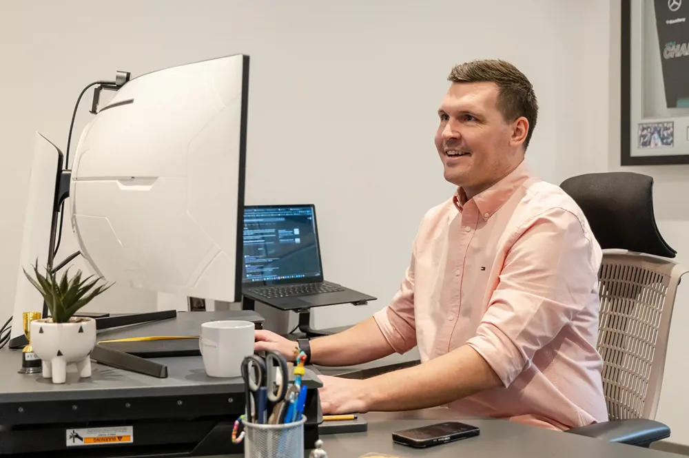 Luke Fribbens, Founder and CEO of Cold Banana working at this desk.