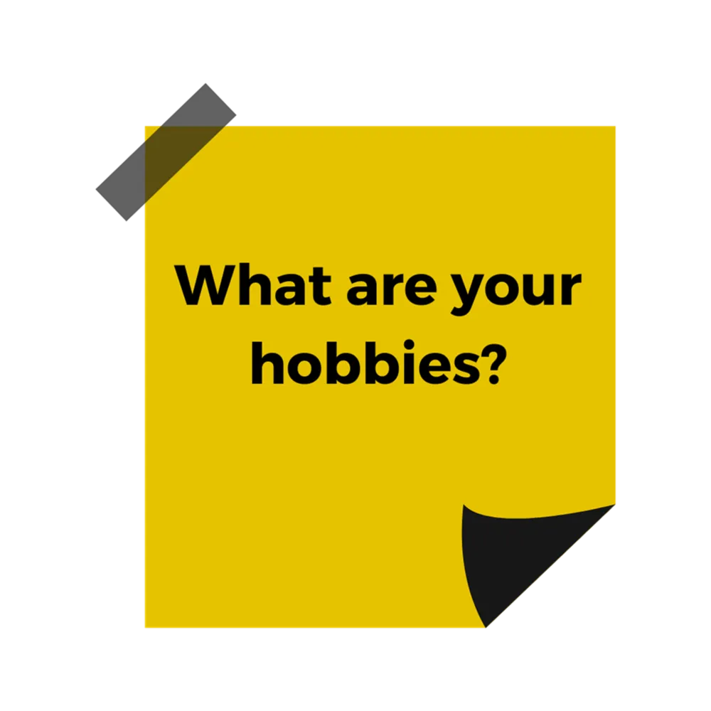 A yellow post it note with black text reading "What are your hobbies?"