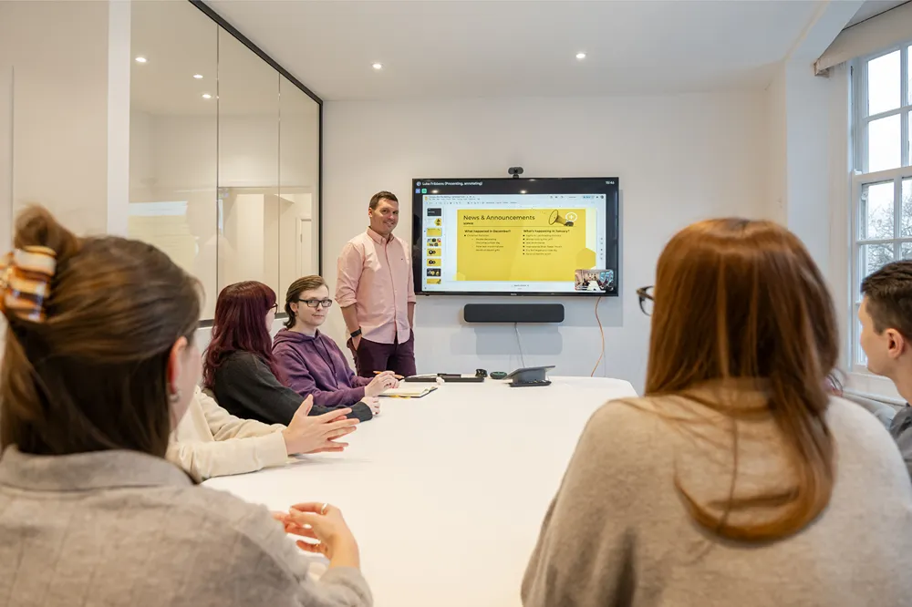 Cold Banana staff in a monthly team meeting
