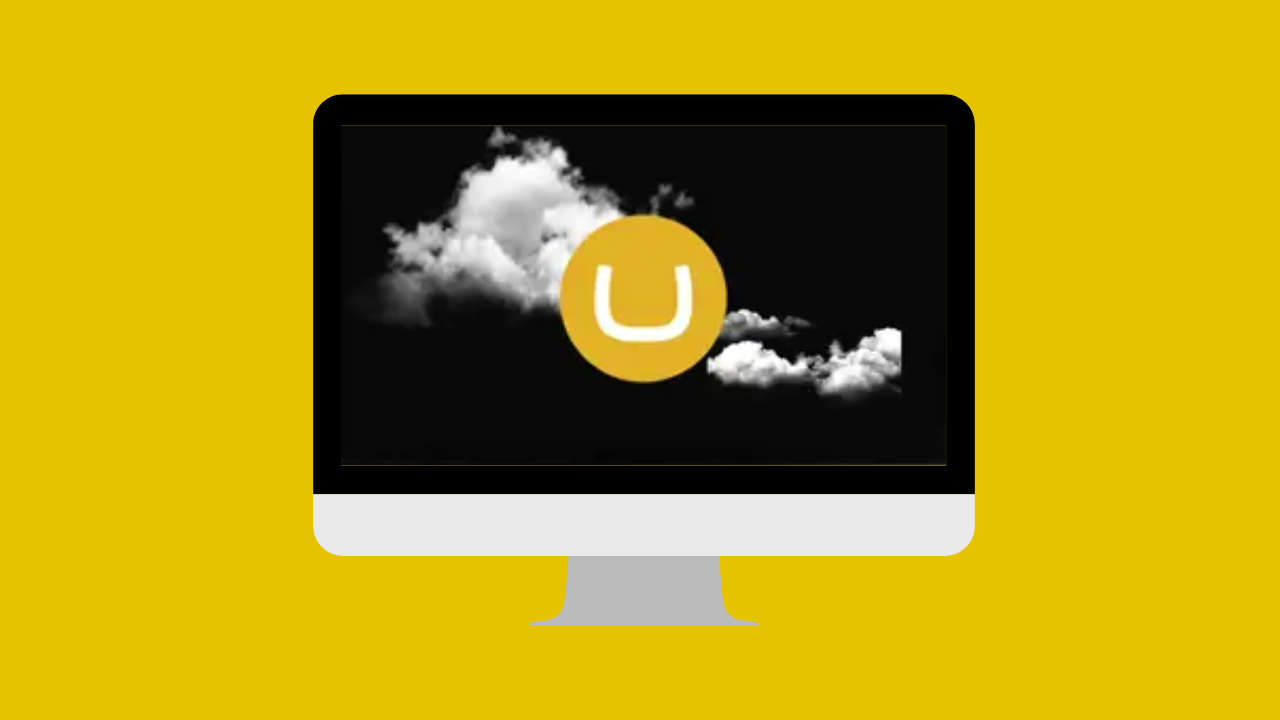 A desktop screen with a yellow Umbraco logo in the middle superimposed over a cloud formation.