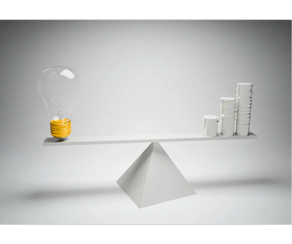 A 3D render of a seesaw with a lightbulb on one end and stacks of coins on the other