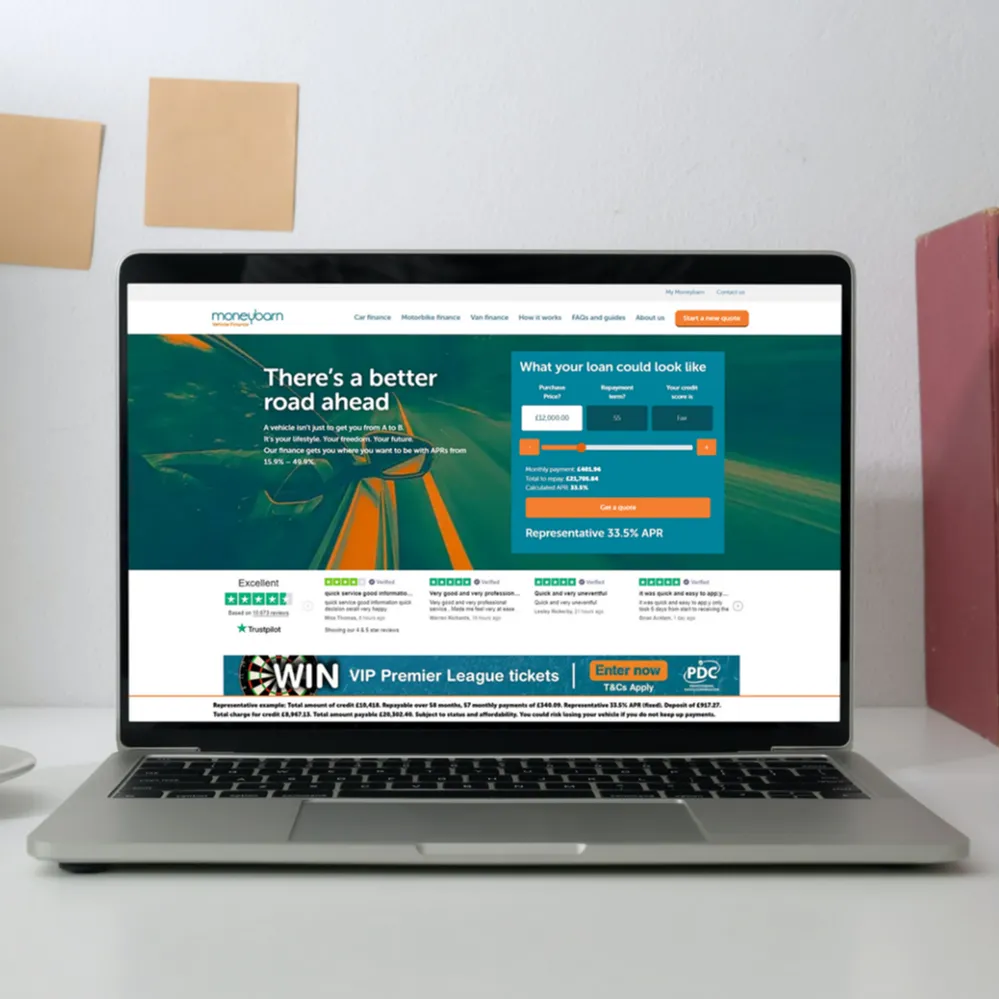 Moneybarn webpage on an open laptop