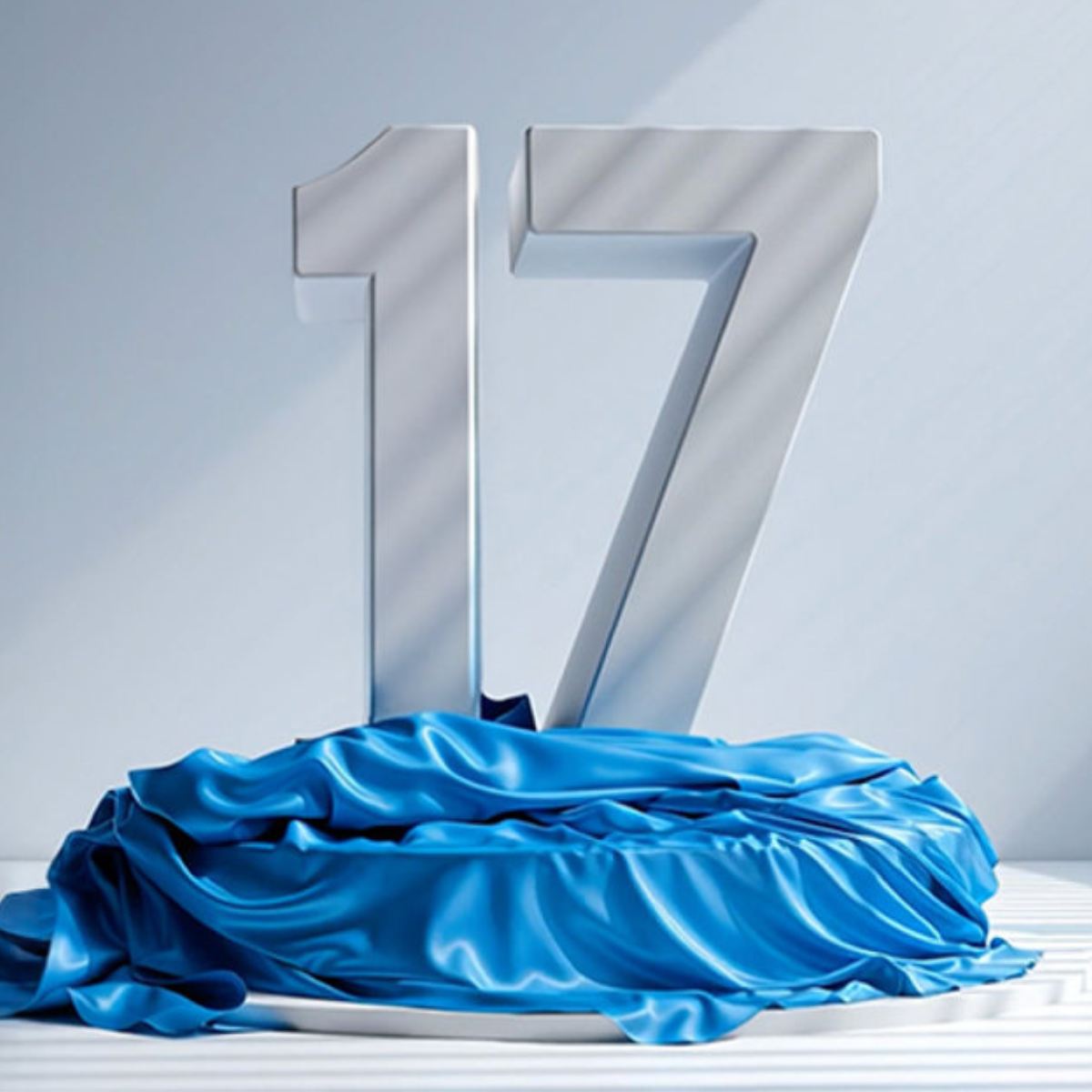 A silver statue of the number 17 on a podium surrounded by blue cloth