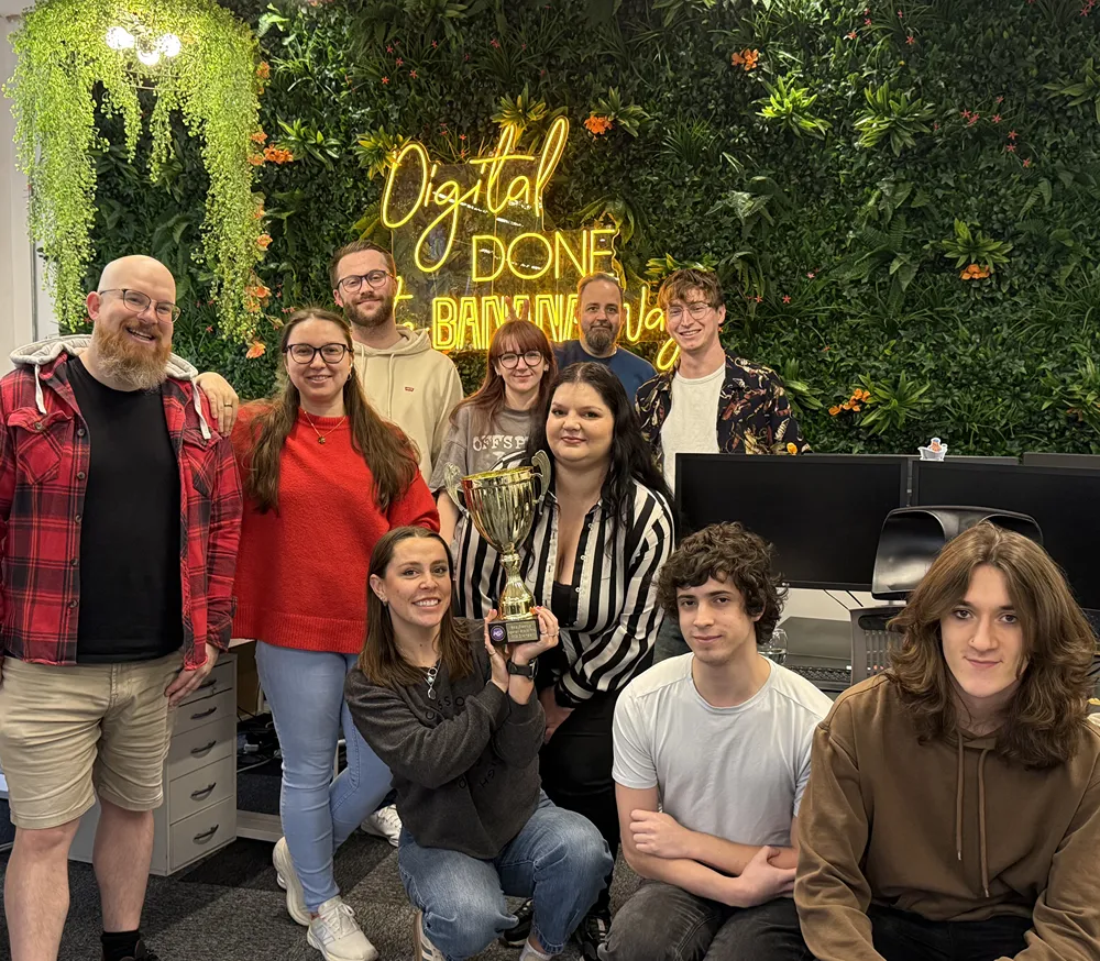 Cold Banana team celebrating an Agency Grand Prix 2025 win with their golden trophy