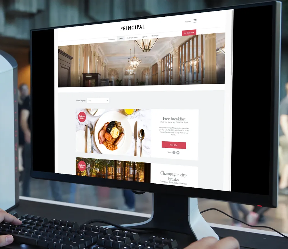 Ph Hotels hotel selection webpage open on a dekstop monitor in an office.
