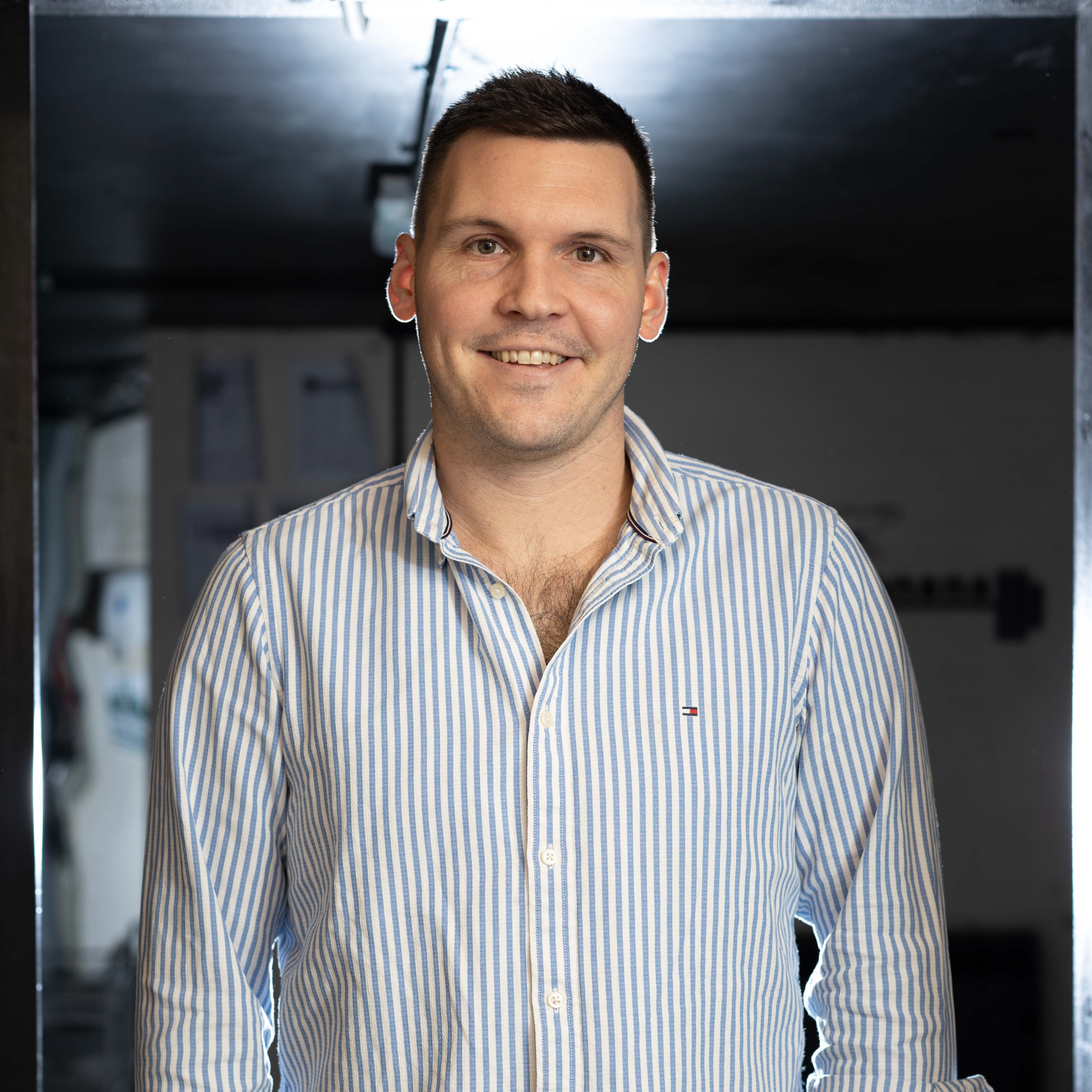 Cold Banana founder Luke Fribbens against the backdrop of the Cold Banana office