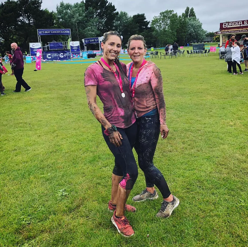 Two Cold Banana employees who completed a Tough Mudder event.