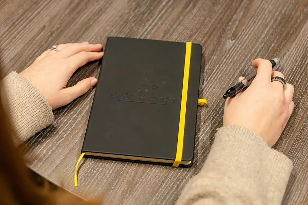 Cold Banana notebook on a table
