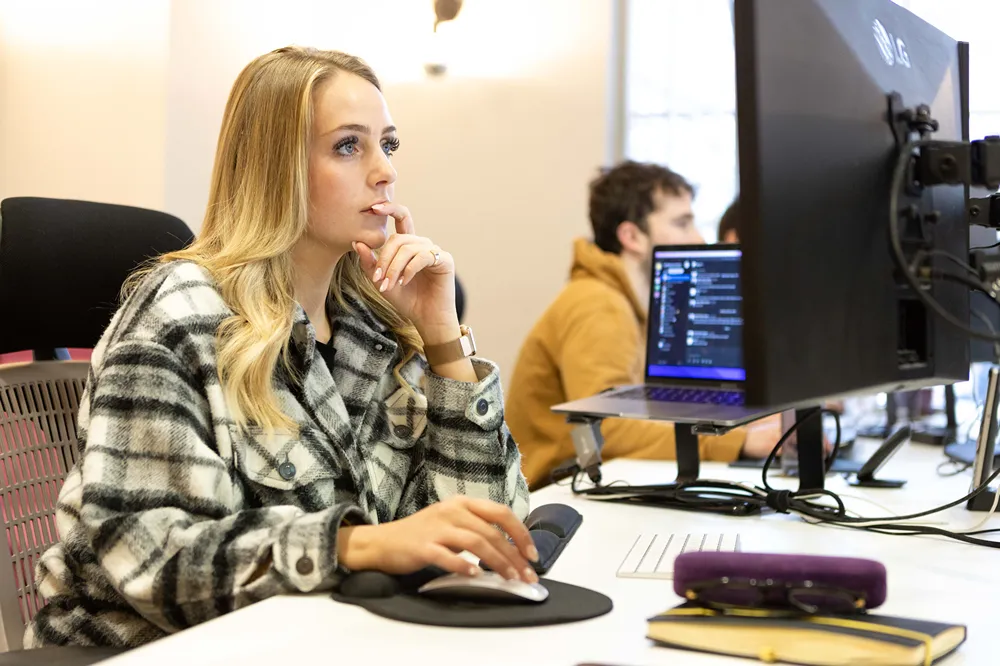 A Cold Banana employee working at their desk.