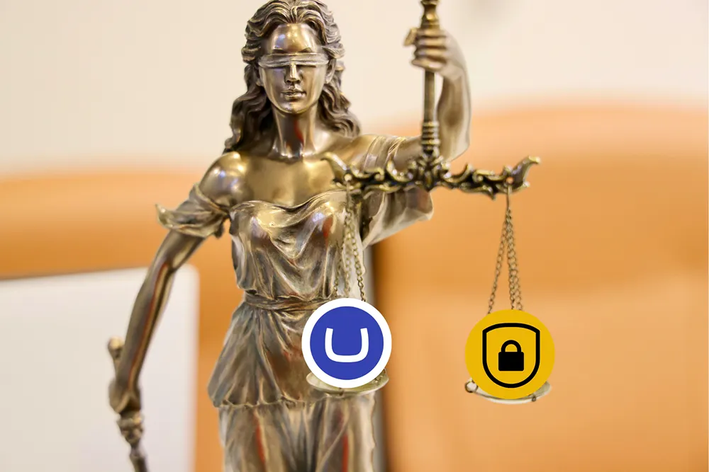 A Lady of Justice statue, with the Umbraco logo on the left scale, and a secure symbol on the right scale.